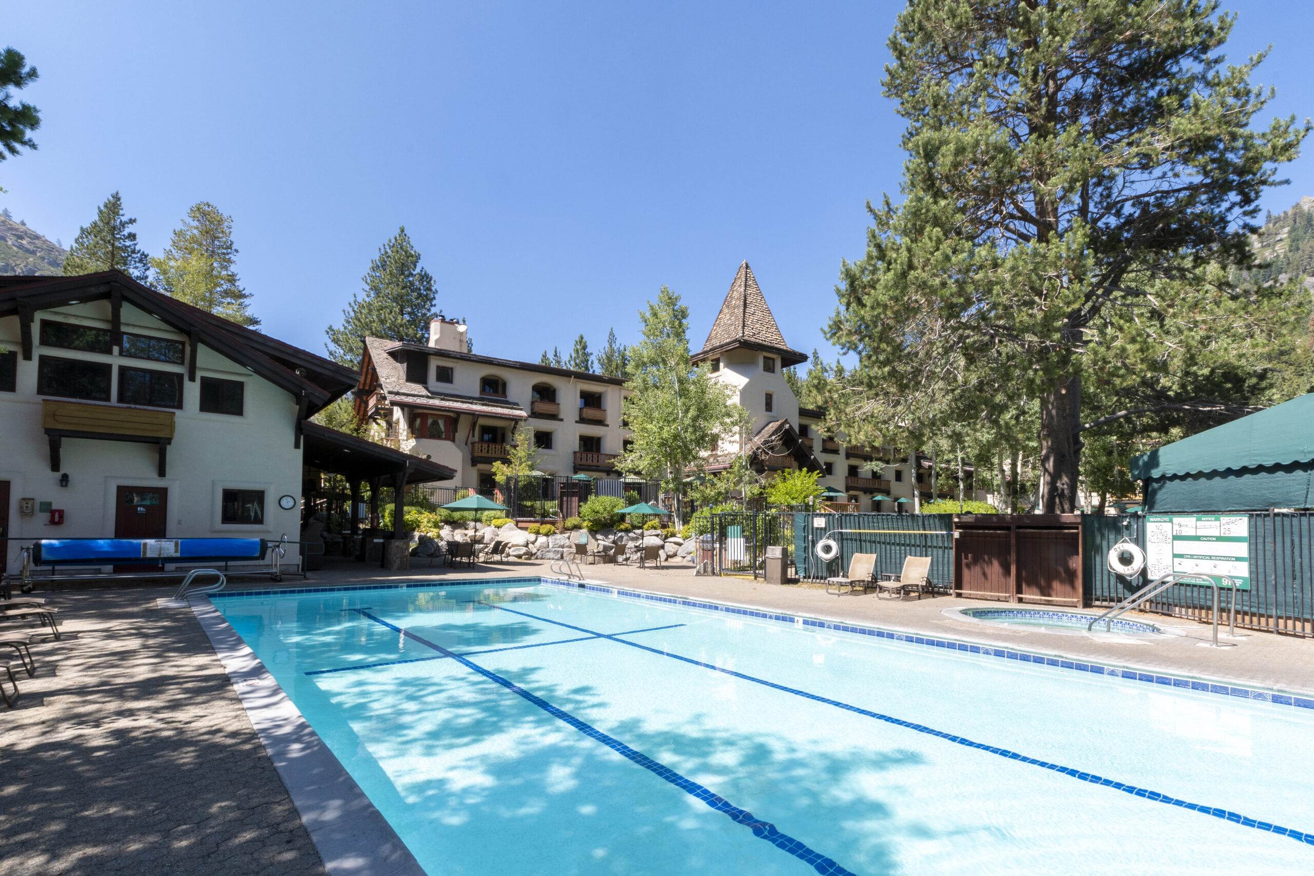 Olympic Village Inn Summer Exterior pool area and clubhouse