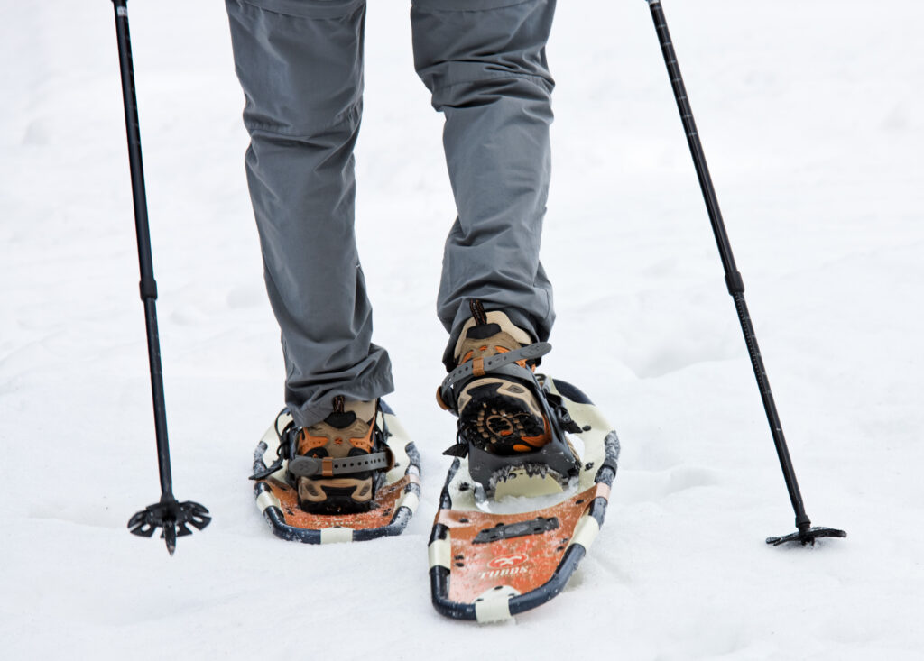 persons feet with snowshoes