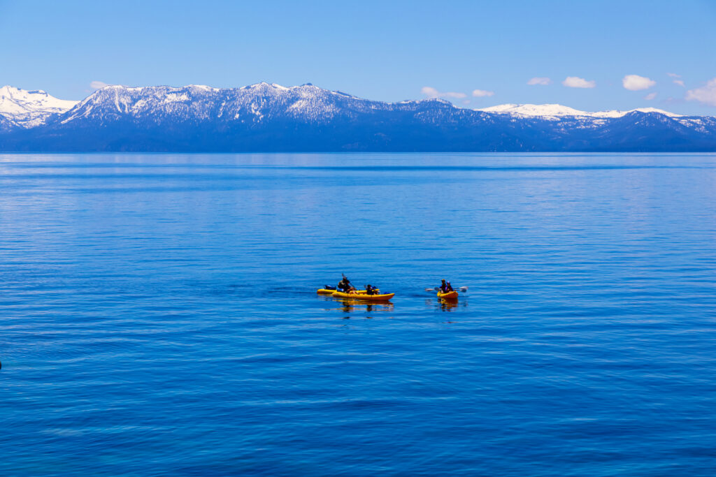 People kayaking in Lake Tahoe during spring season